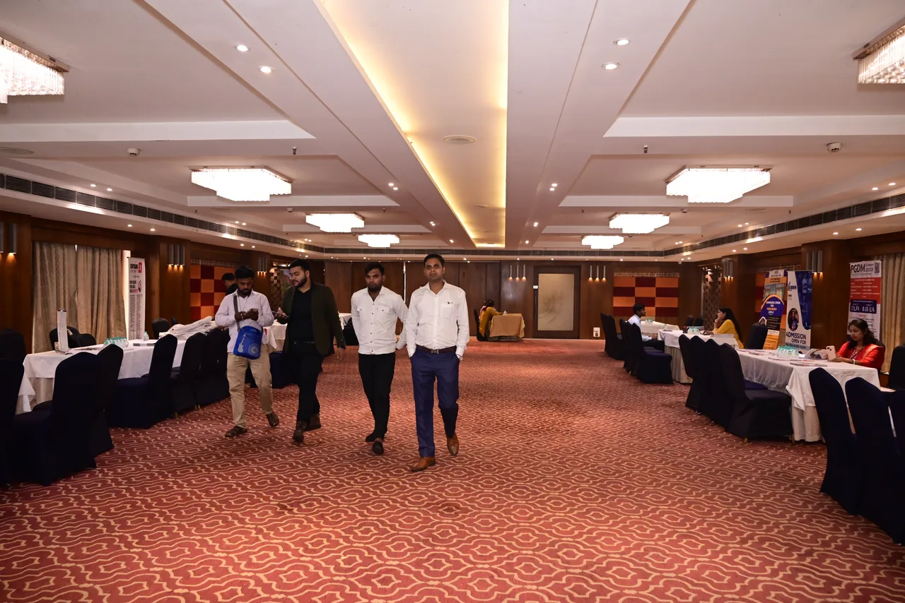 Visitors walking through the education exhibition venue