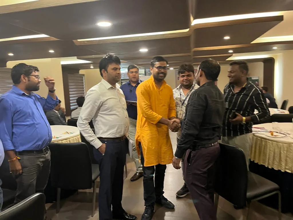 Participants greeting each other at an educators gathering